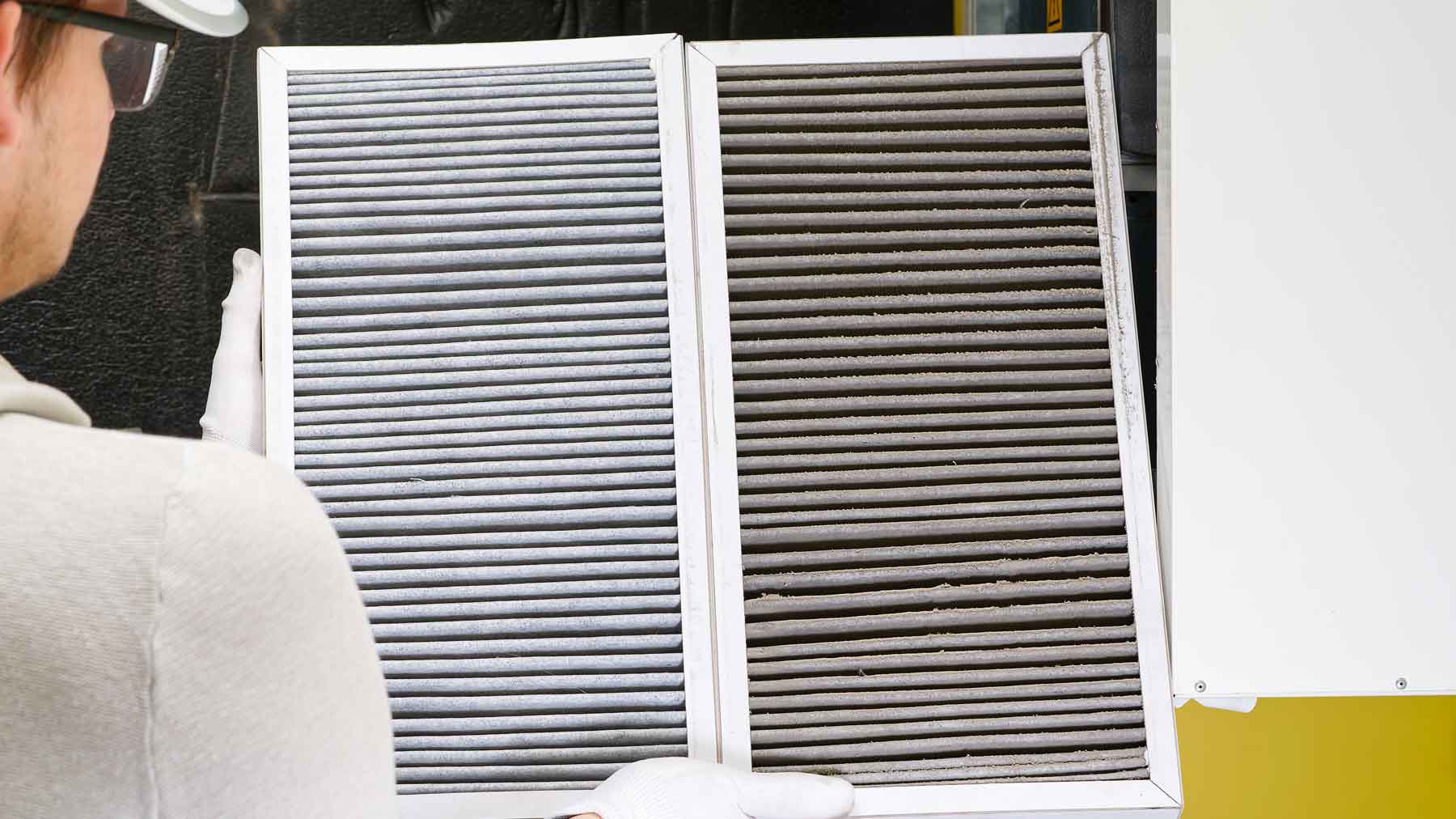 Woman with dirty air filter | Davis Temp Control
